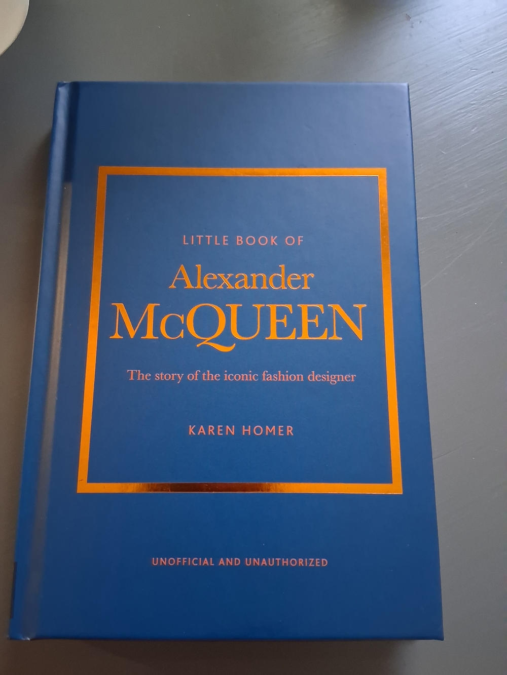 Alexander McQueen Blue Cover with Metallic Orange Foil